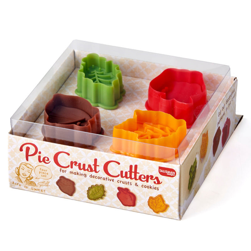 Set of pie crust cutters in a box with colorful designs on a white background