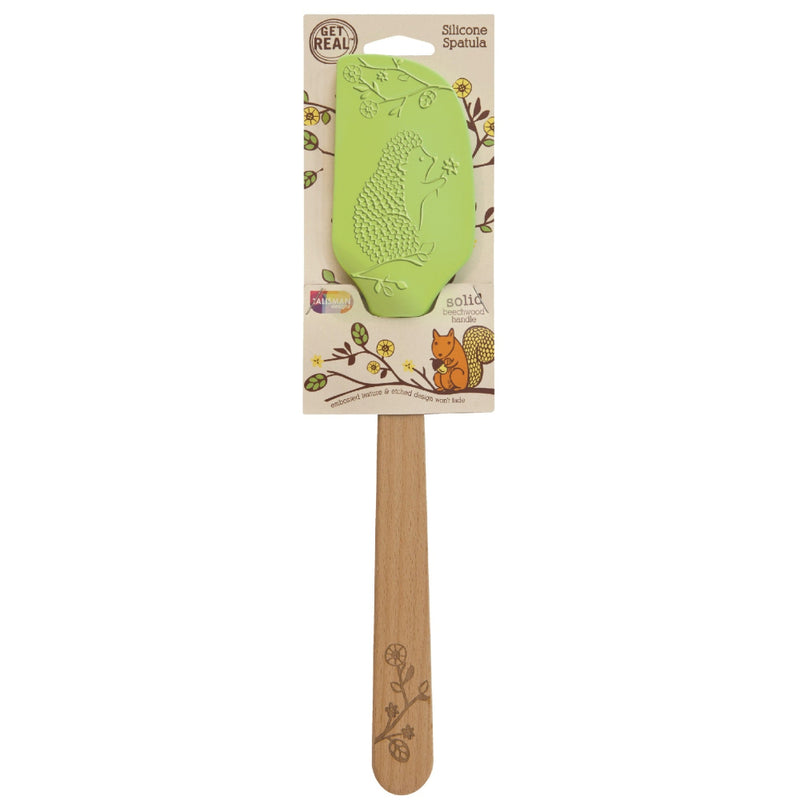 A large silicone spatula with a hedgehog design on the head and a beechwood handle, displayed on a packaging card with floral illustrations.